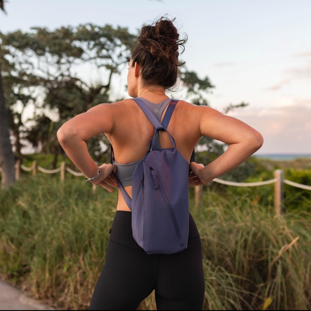 DAE Activewear Sling Bag Backpack Purse Muted Berry Blue Purple Purse Yoga Hike